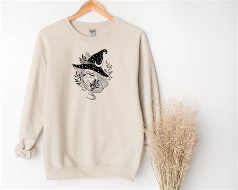 Bring a Little Magic into Your Wardrobe with This Witchcraft Sweatshirt